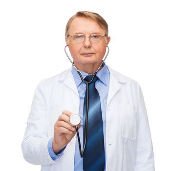 healthcare and medicine concept - smiling standing doctor in eyeglasses or professor in eyeglasses with stethoscope