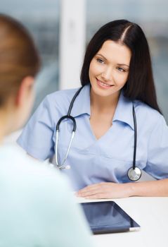 healthcare, medicine and technology - female doctor or nurse with tablet pc computer having appointment with patient