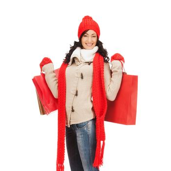 retail and sale concept - full-length picture of happy woman in winter clothes with shopping bags