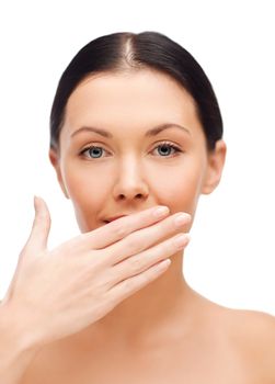 spa, health and beauty concept - beautiful woman covering her mouth