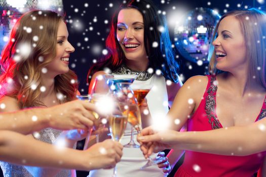 new year, celebration, friends, bachelorette party, birthday concept - three women in evening dresses with cocktails in club or bar