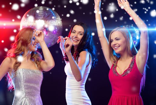 party, new year, celebration, friends, bachelorette party, birthday concept - three beautiful women in evening dresses dancing in the club