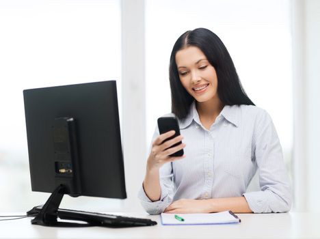 education, school, business, communication and technology concept - smiling businesswoman or student with computer and smartphone texting