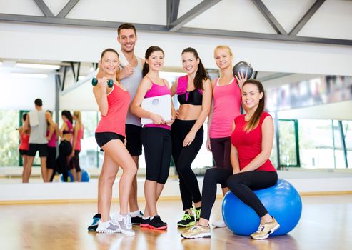 fitness, sport, training, gym and lifestyle concept - group of smiling people in the gym