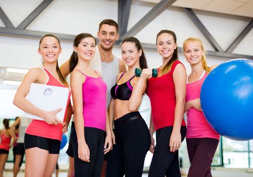 fitness, sport, training, gym and lifestyle concept - group of smiling people in the gym