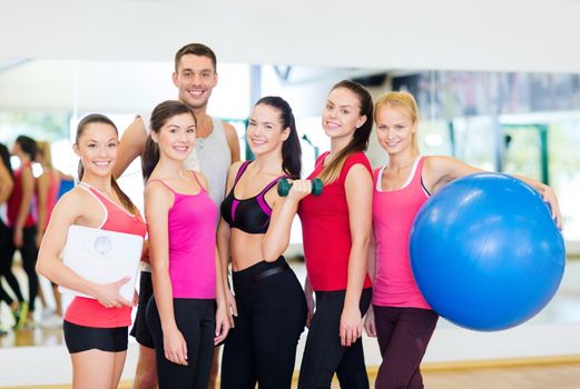 fitness, sport, training, gym and lifestyle concept - group of smiling people in the gym