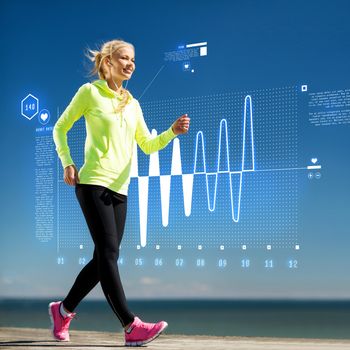 fitness, sport, training, technology and lifestyle concept - woman doing sports outdoors with earphones