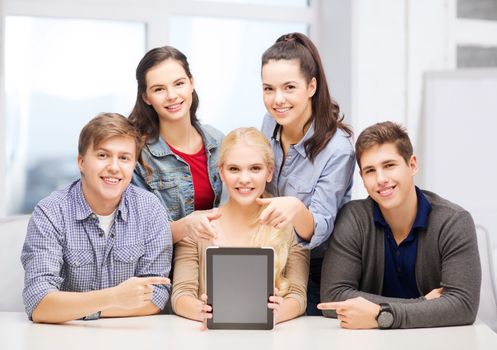 education, technology, advertisement and internet concept - group of smiling students with blank black tablet pc screen