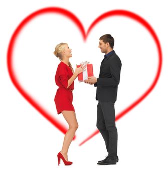 love, family and holidays concept - romantic couple with gift box