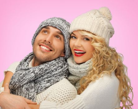 love, family and holidays concept - romantic couple in winter clothes