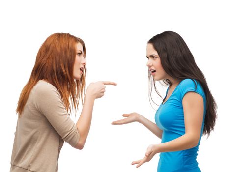 bullying, friendship and people concept - two teenagers having a fight