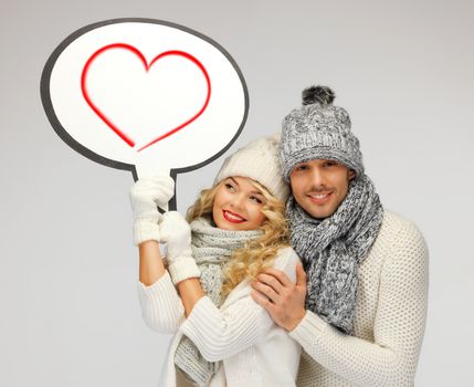 winter, relationships and happiness concept - family couple with blank text bubble