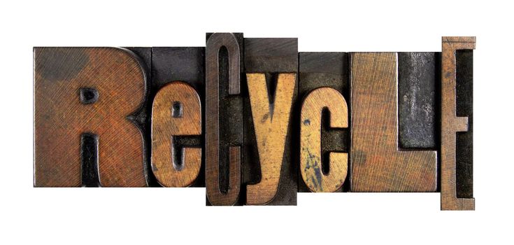The word RECYCLE written in vintage letterpress type