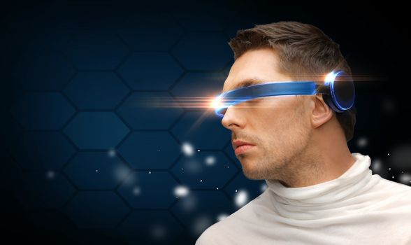 future technology concept - handsome man with futuristic glasses