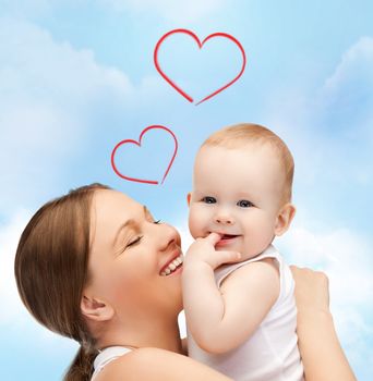 family, children, parenthood and happiness concept - happy mother with adorable baby