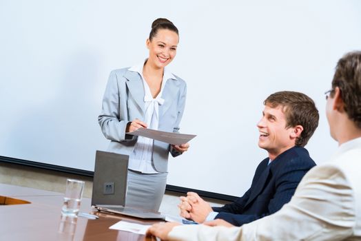 image of a discusses business woman with colleagues