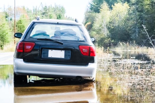 Car Stuck after a Water Flood on a Country Road