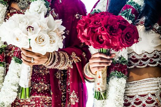 Red and White Traditional Indian Wedding Bouquets and brides