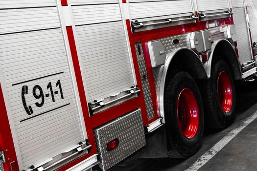 Red Firetruck Details of the Side and of the 911 telephone Sign