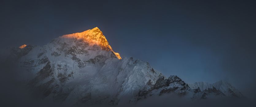 Himalya summits Everest and Nuptse at sunset. Large panoramic view
