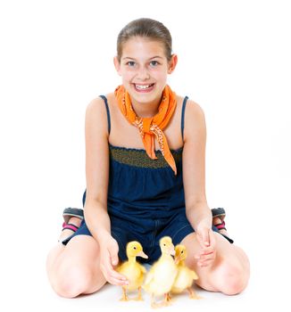 Happy cute girl with cute ducklings isolated on white background