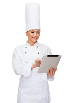 cooking, technology and food concept - smiling female chef with tablet pc computer