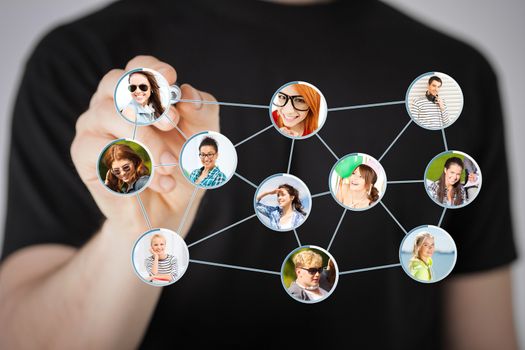 communication and social networking concept - closeup of man drawing social network on virtual scneen