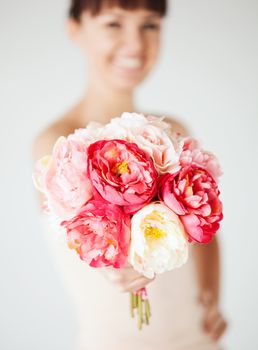 flowers and love concept - closeup of woman hands with bouquet of flowers