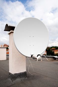 television antenna mounted on roof of the high-rise building