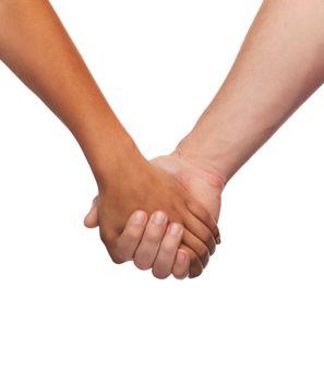 love and relationships concept - closeup of woman and man holding hands