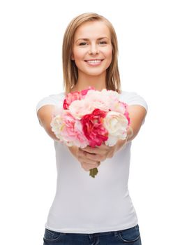 holidays, love and flowers concept - young woman with bouquet of flowers