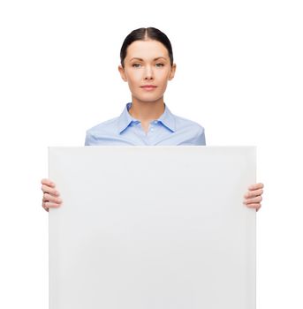 business and education concept - serious young smiling businesswoman with white blank board