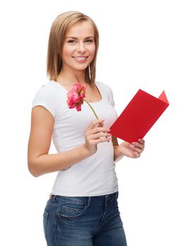 love, holidays and happiness concept - smiling girl with postcard and flower