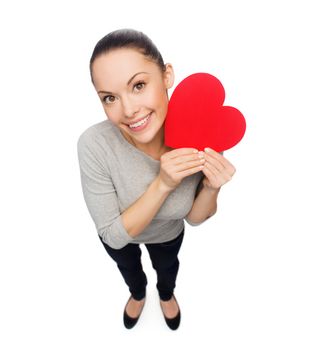 happiness, love and health concept - smiling asian woman with red heart