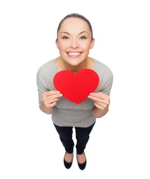 happiness, love and health concept - smiling asian woman with red heart