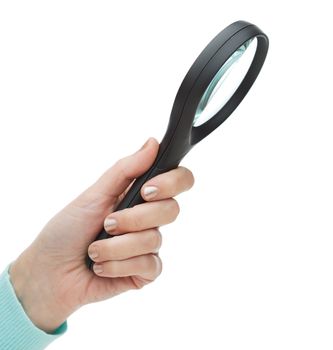 investigation and education concept - close up of woman hand holding magnifying glass