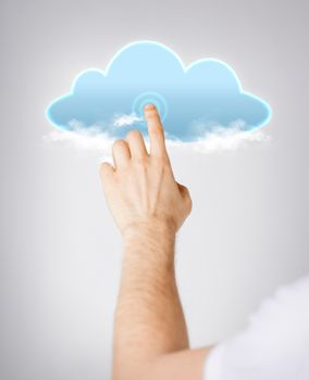 modern technology and cloud computing concept - closeup of man hand pointing at cloud