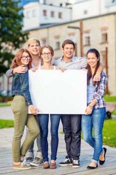 summer holidays, advertisement, education, campus and teenage concept - group of students or teenagers with white blank board
