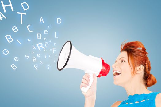 communication concept - redhead woman with megaphone over blue background