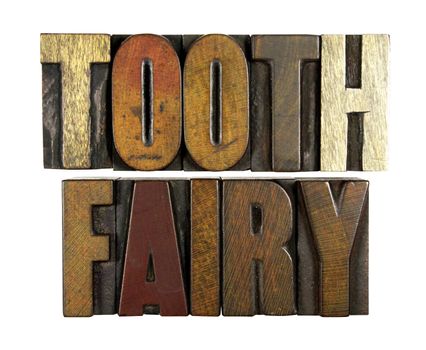The words TOOTH FAIRY written in vintage letterpress type