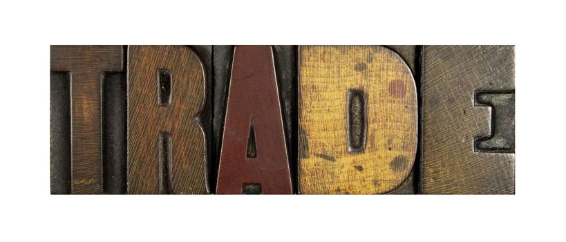 The word TRADE written in vintage letterpress type