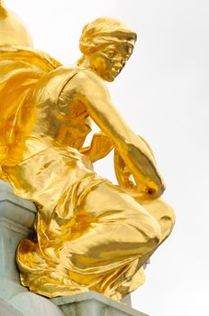 Gold statues on top of the Queen Victoria Memorial in London