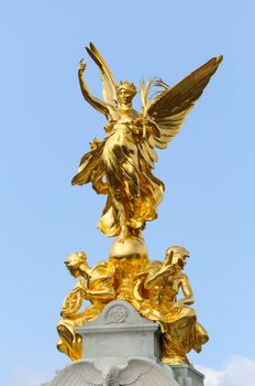 Gold statues on top of the Queen Victoria Memorial in London