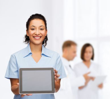 healthcare, medicine and technology concept - smiling african american female doctor or nurse with tablet pc computer
