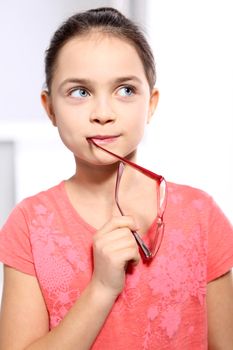 pensive girl in pink glasses