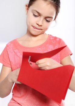 Caucasian girl with card for Valentine's Day or Mother's Day