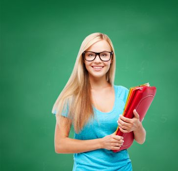 school and education concept - smiling student with folders