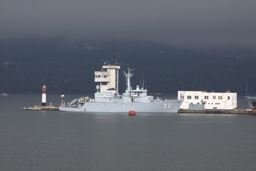 Bulgarian war ship in the  harbor, against the storm