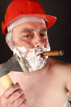 man with helmet and cigar shave himself with an ax