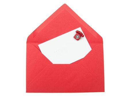 Blank business card inside an open envelope with a small phone on one side 